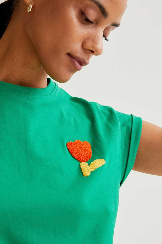 Green T-shirt with red tulip embroidery